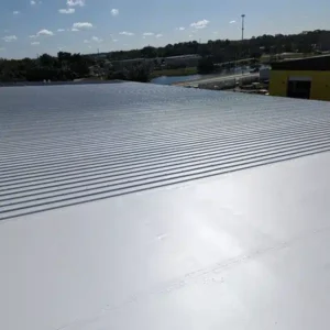 Side-by-side view of old and newly replaced foam roof sections, illustrating repair versus replacement outcomes.