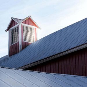 A clean, reflective coating on a commercial roof, showing what a roof should look like if it’s regularly maintained.