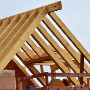 A partially constructed wooden roof frame, representing different roofing structures and materials used in commercial buildings.