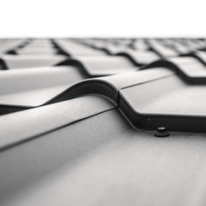 A close-up of a modern metal roof, showcasing its durability and weather-resistant properties as a long-term investment.